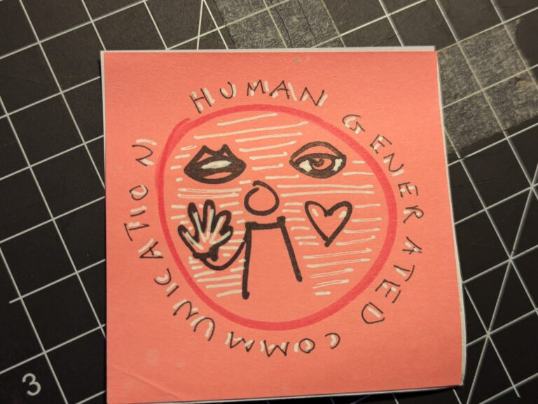 a stickie note with a drawing of a stick person with a mouth an eye an a heart icon around it. Text says "human generated communication"